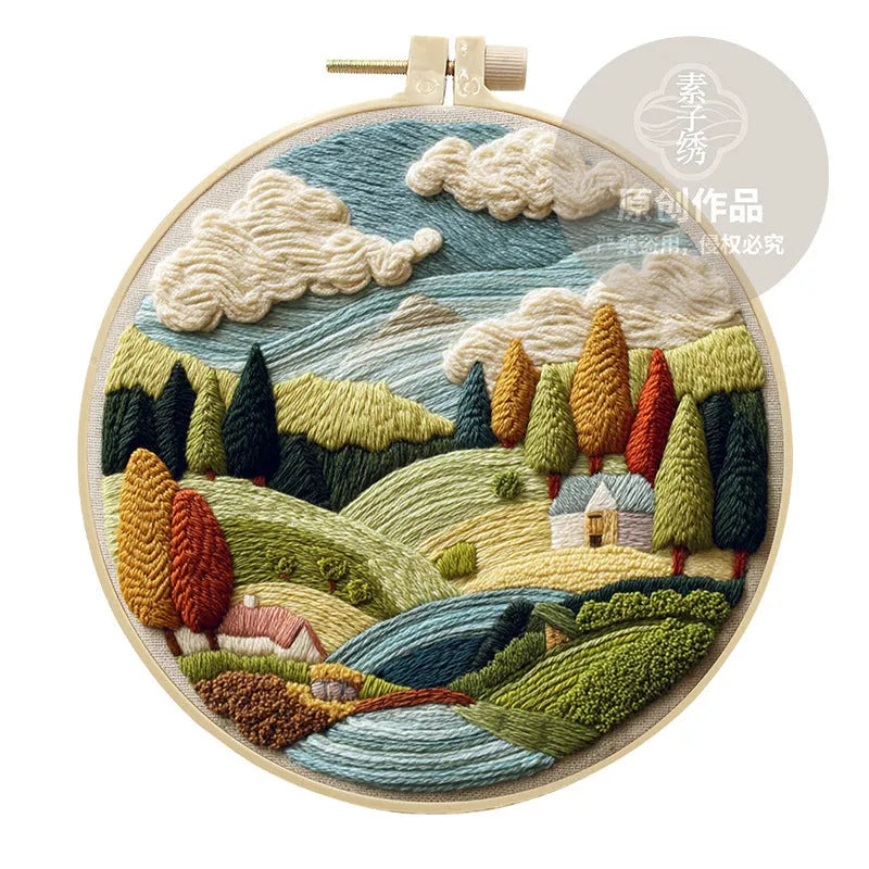 Embroidery DIY kit with landscape-printed cotton fabric, thread, needles, and a 15cm bamboo-style frame.