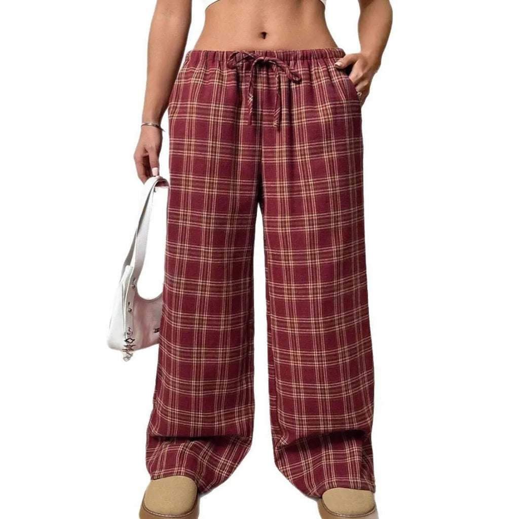 Women's blue and red plaid casual trousers with drawstring waist and side pockets.