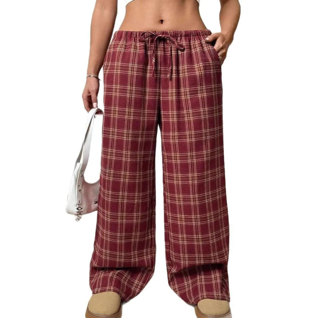 Women's blue and red plaid casual trousers with drawstring waist and side pockets.