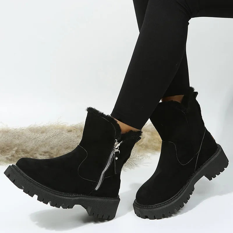 Women's black high-top snow boots with side zipper and round toe, made from cow suede.