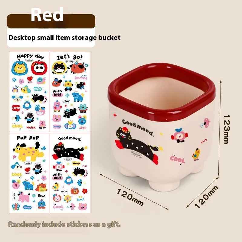Red and brown cartoon-style plastic desktop storage organiser with grid compartments.