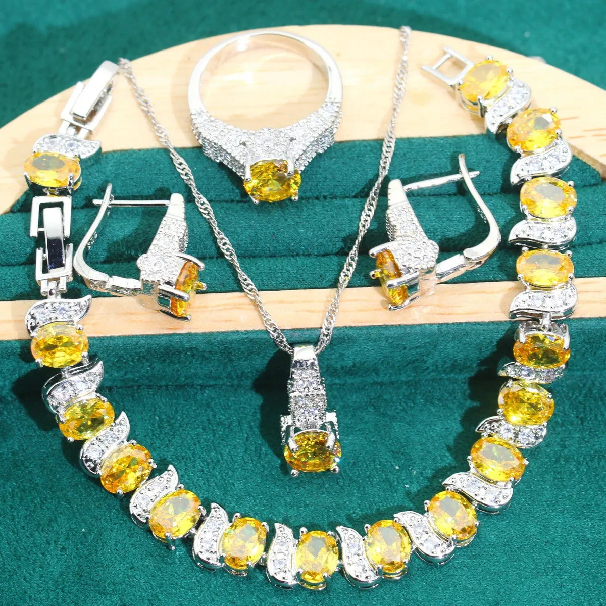 Bridal zircon jewellery four-piece set showing necklace, bracelet, earrings, and ring with water wave chain styling