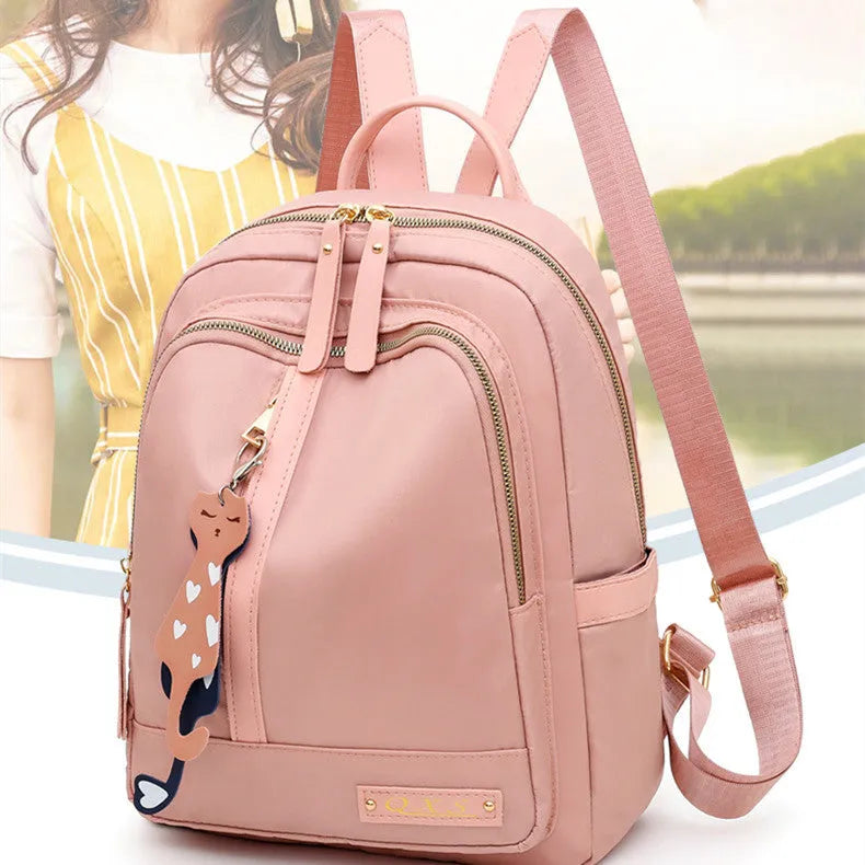 Women's black nylon casual backpack with double shoulder straps and external pockets