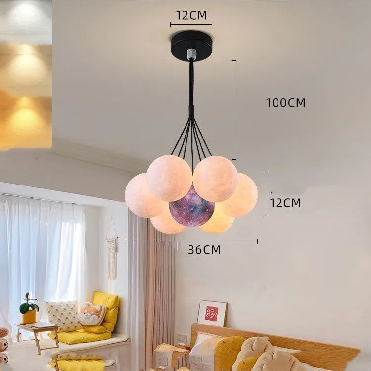 Nordic fish chandelier with moon bubble design in gold or black colours, showing iron body and PMMA lampshades