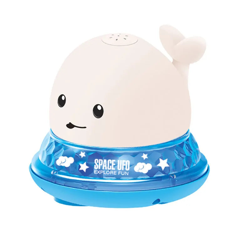 Whale-shaped baby bath toy with automatic water spray and colourful lights floating in water.