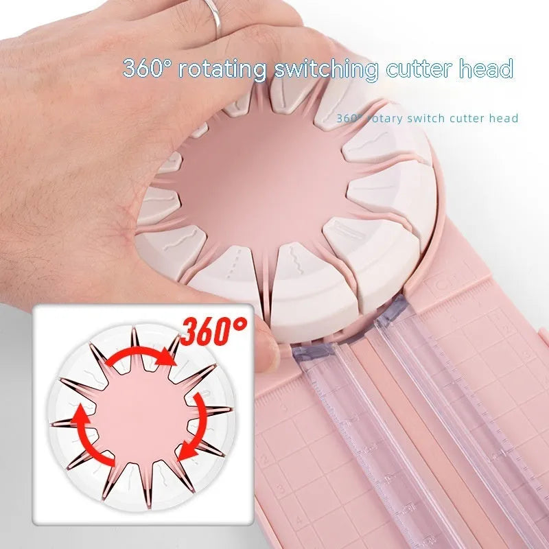 Pink plastic paper cutting machine with dotted pattern design and 12 interchangeable blades