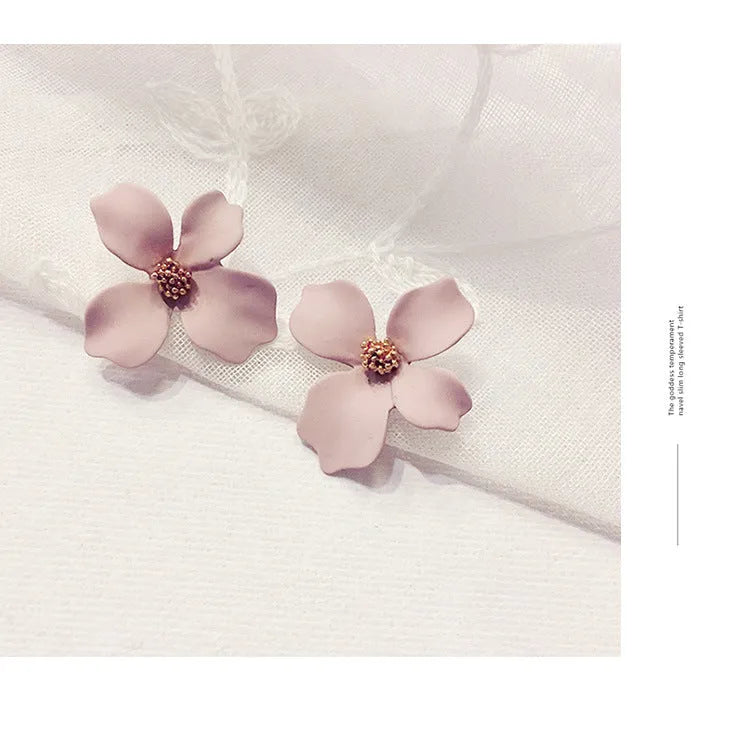Flower shaped stud earrings in pink or white colour with electroplated alloy construction