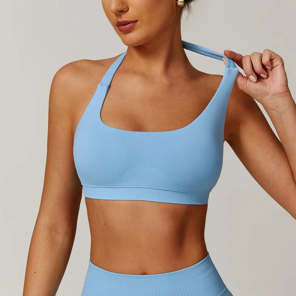 Women's halter neck sports bra in nylon with built-in pads and medium support
