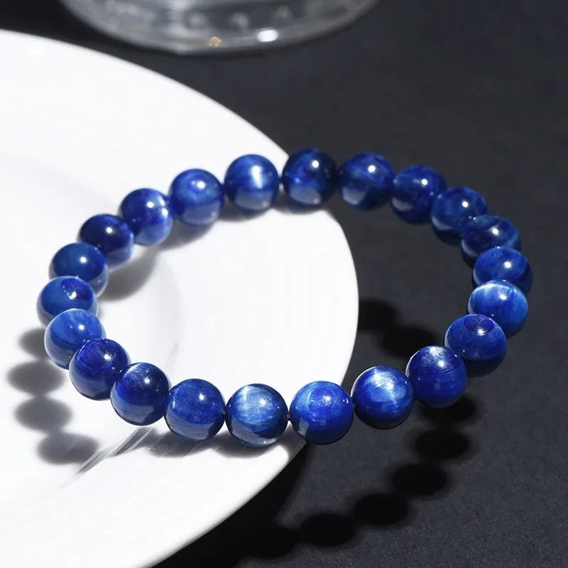 Polished grade 7A blue crystal bracelet with geometric ruyi design, shown in single circle and piece sizes.