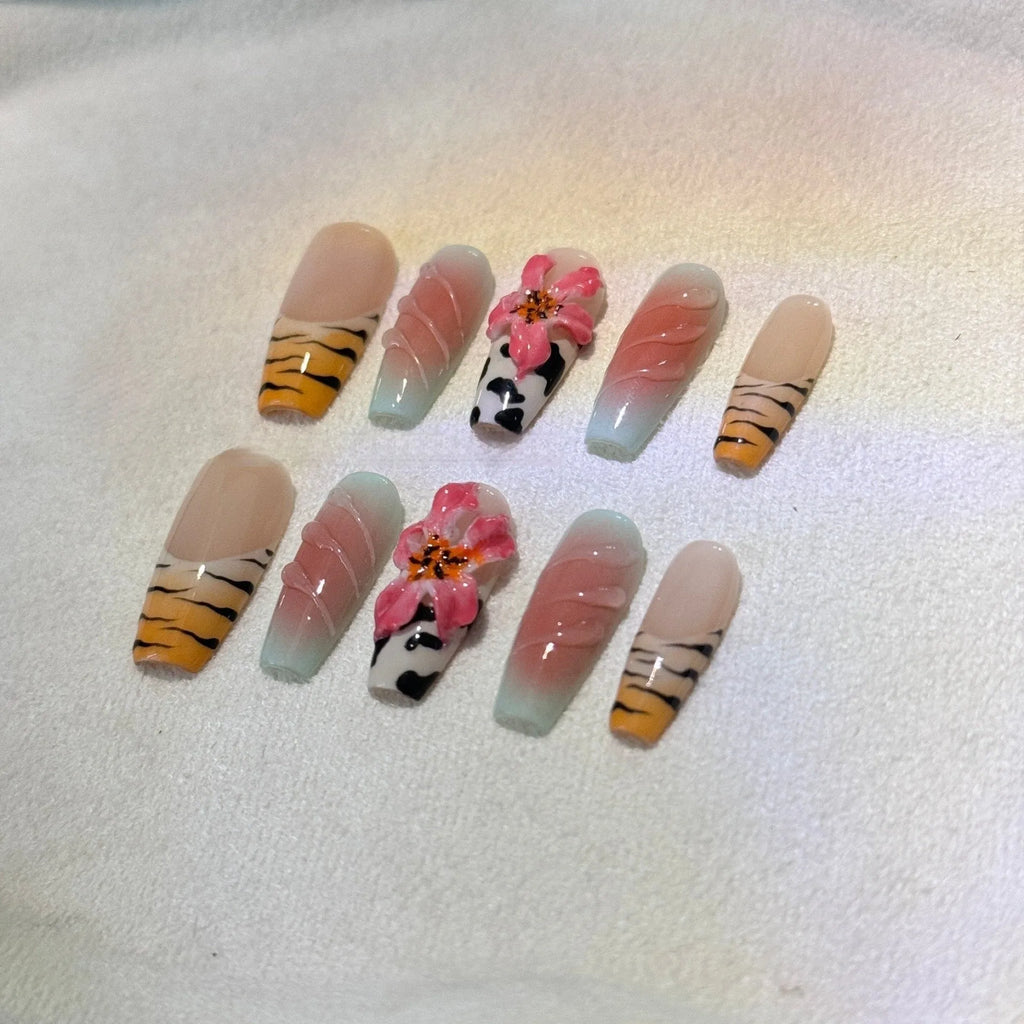 Hand carved false nails featuring a textured zebra pattern lily design in sizes XS, S, M, L.