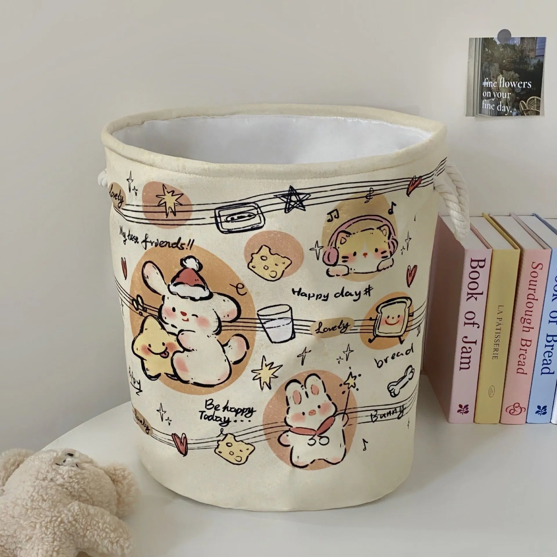Foldable cotton cloth laundry basket in a character print colour, shown unfolded for use.