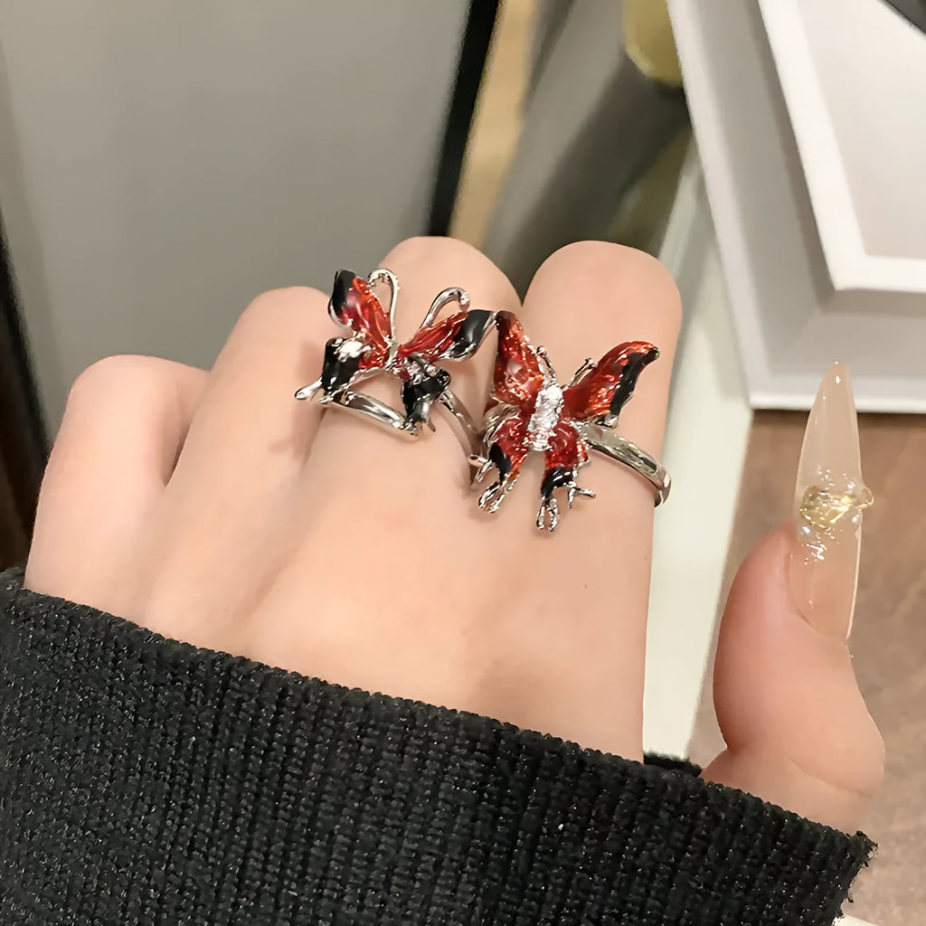 Women's butterfly design ring made from copper with an oil-drip finish, showing one of 33 colour variants.