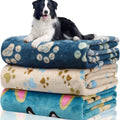 Blue dog cartoon print pet blanket laid flat, showing double-sided flannel texture.
