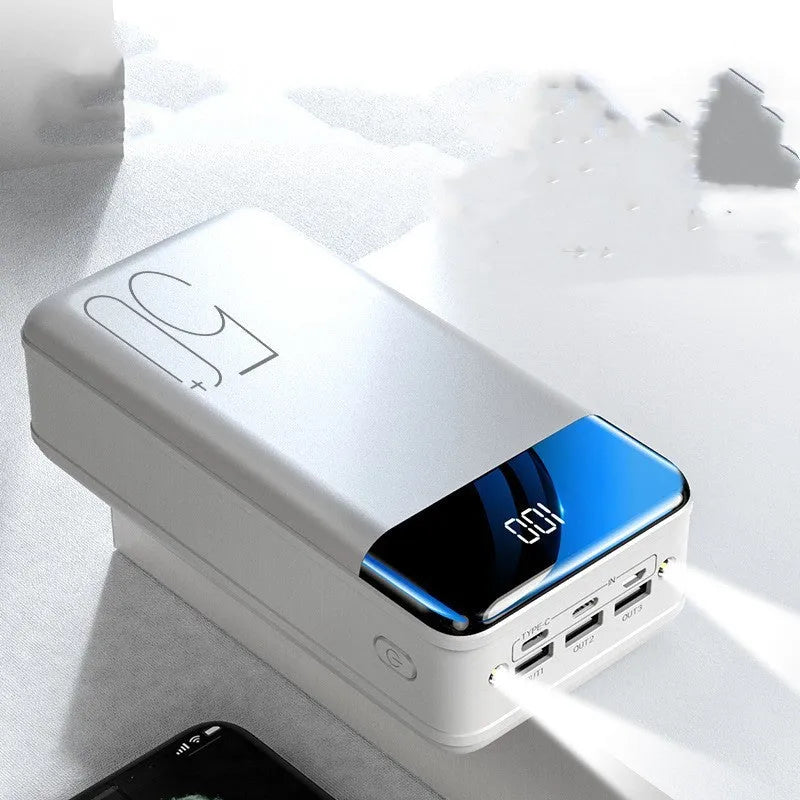 Large capacity 50000mAh power bank with three USB ports in black or white plastic casing