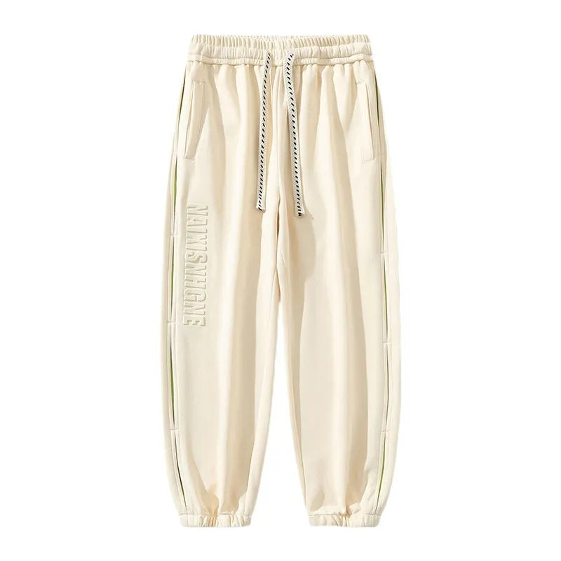 Men's loose-fit cotton trousers with ankle banded design in grey green colour