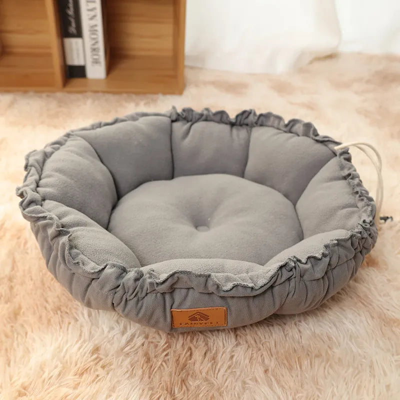 Grey donut-shaped cat bed with reversible cushion insert shown in medium size