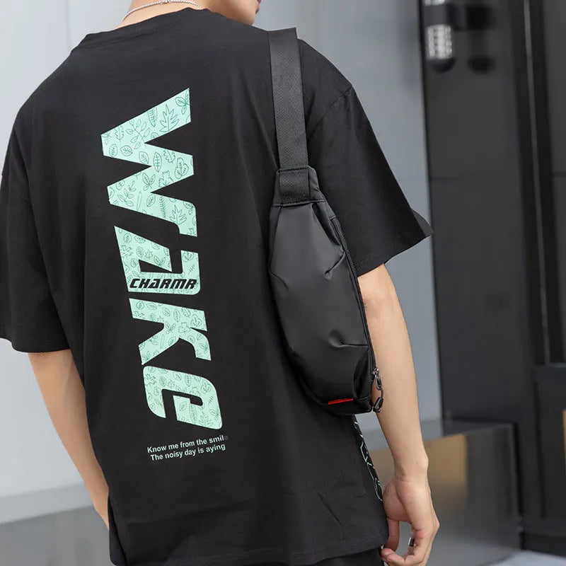 Black Oxford cloth men's waist pack with crossbody strap, shown with zipper open revealing phone and ID pockets.