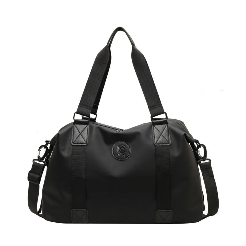 Large black waterproof Oxford cloth travel bag with dry-wet separation compartments.