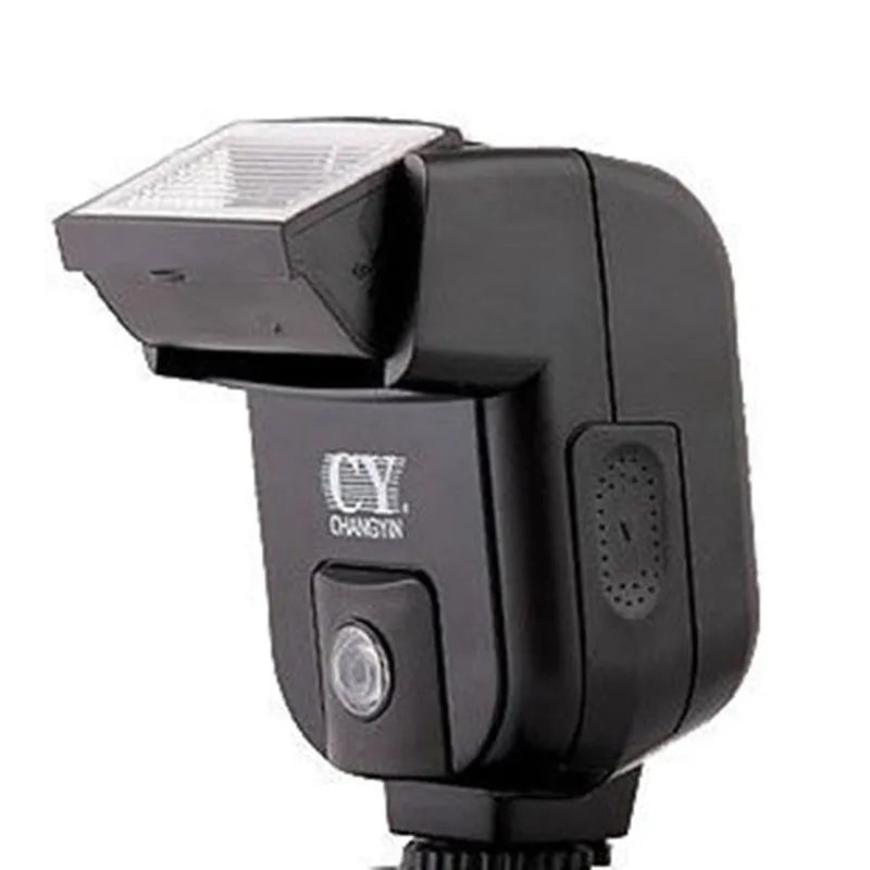 Compact black external camera flashgun with a tilted flash head, shown mounted on an SLR camera hot shoe.