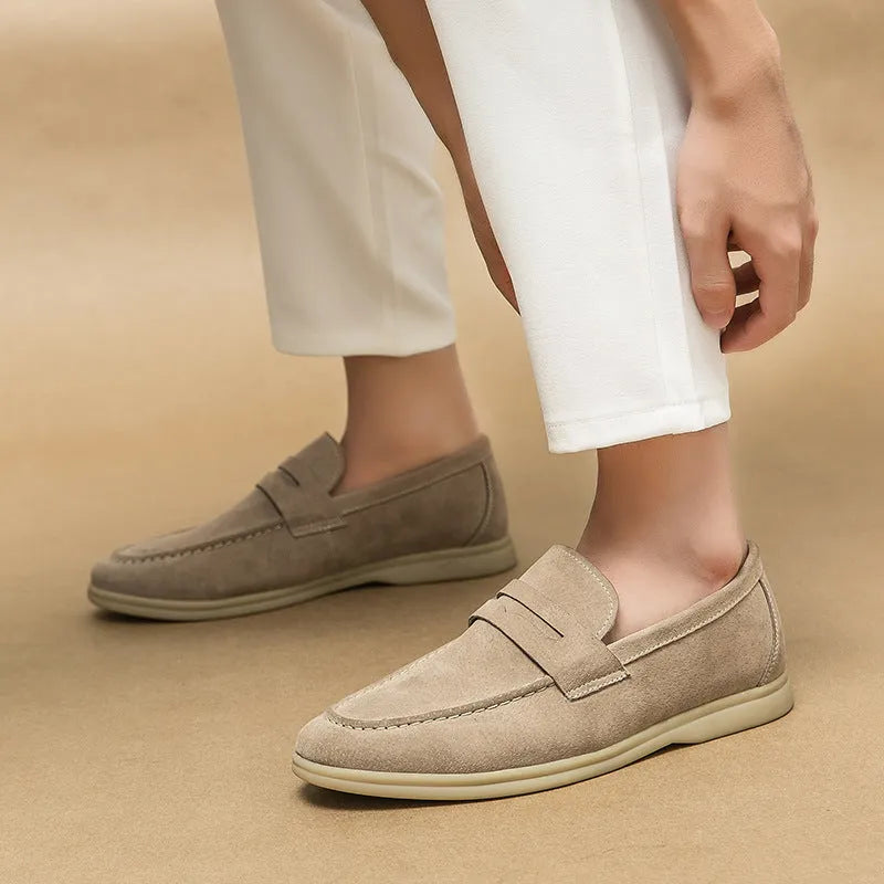 Men's beige slip-on leather casual shoes with a round toe and mid-height rubber sole.