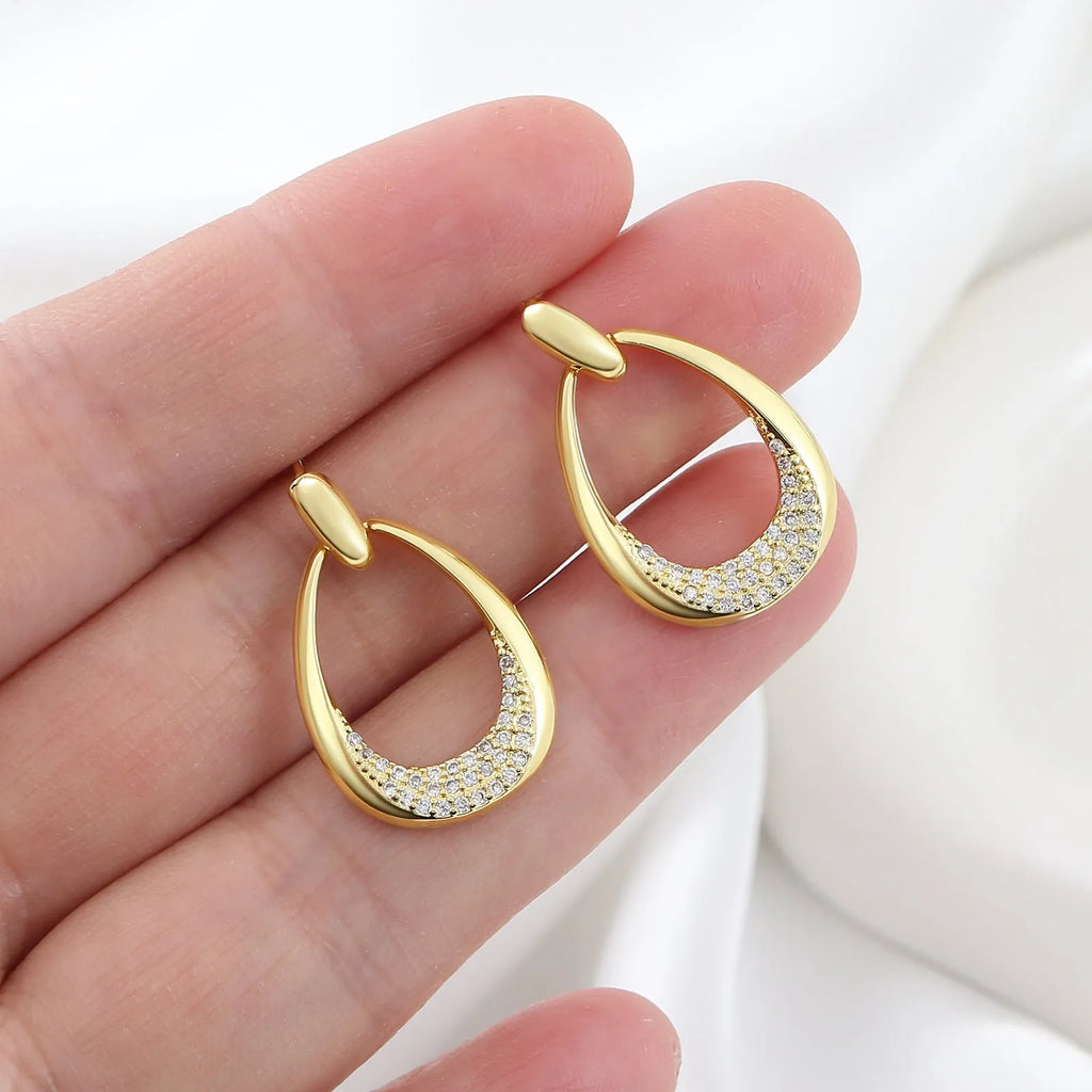 Yellow gold geometric drop earrings with ring design measuring 2.6 by 1.7 centimetres