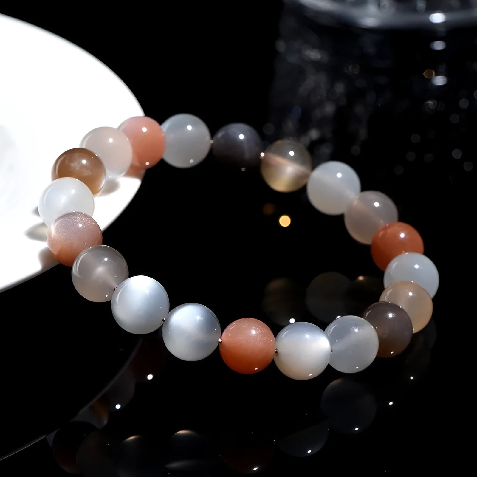 Natural colourful moon light moonstone duobao bracelet with 8mm beads on an adjustable band.