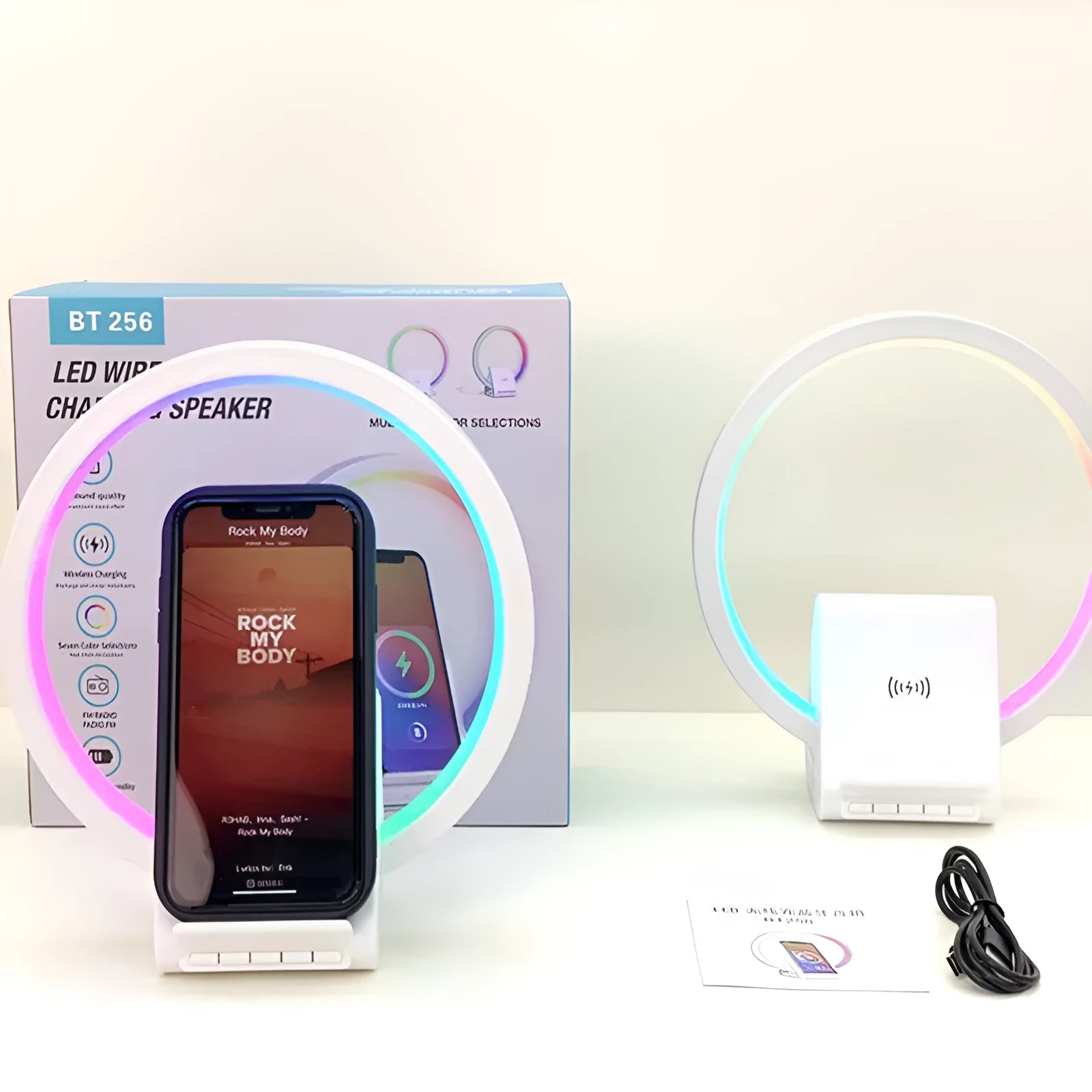 White smart Bluetooth speaker with LED ambience light and wireless charging surface