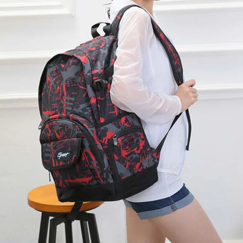 Classic blue nylon backpack with large main compartment and adjustable straps.
