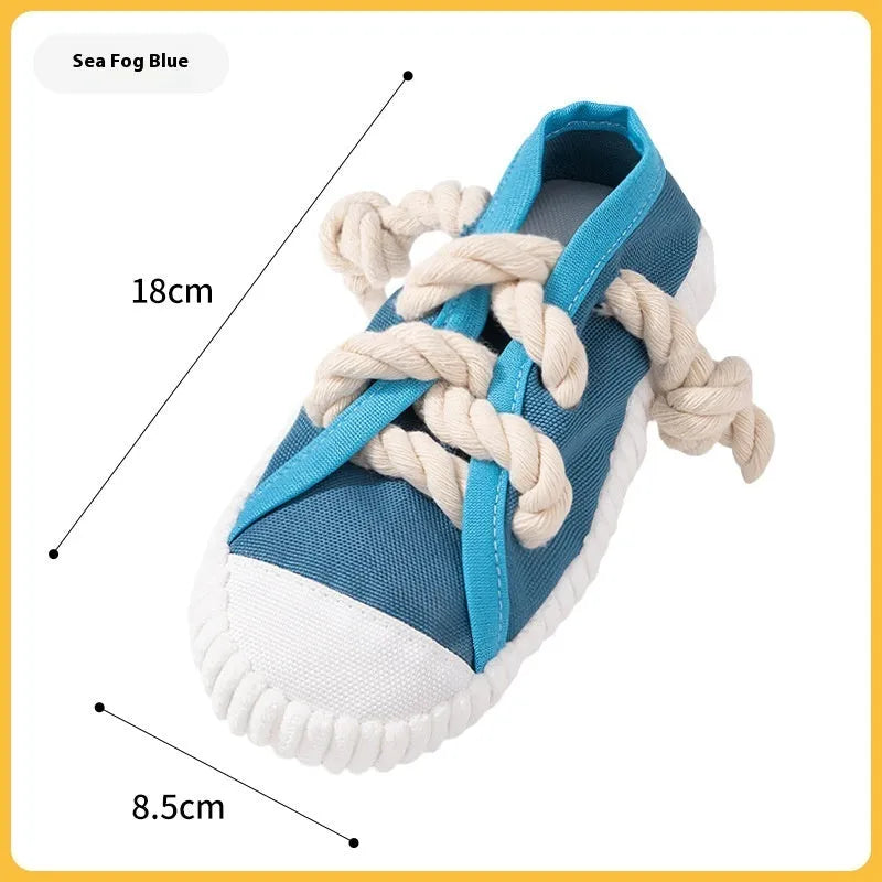A bendable plastic dog slippers squeaker toy in yellow, black, or blue for chewing and play.
