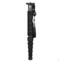 Black carbon fibre SLR camera monopod fully extended, showing its 6-section telescopic design.