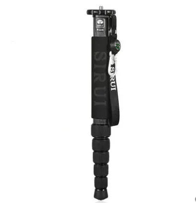 Black carbon fibre SLR camera monopod fully extended, showing its 6-section telescopic design.