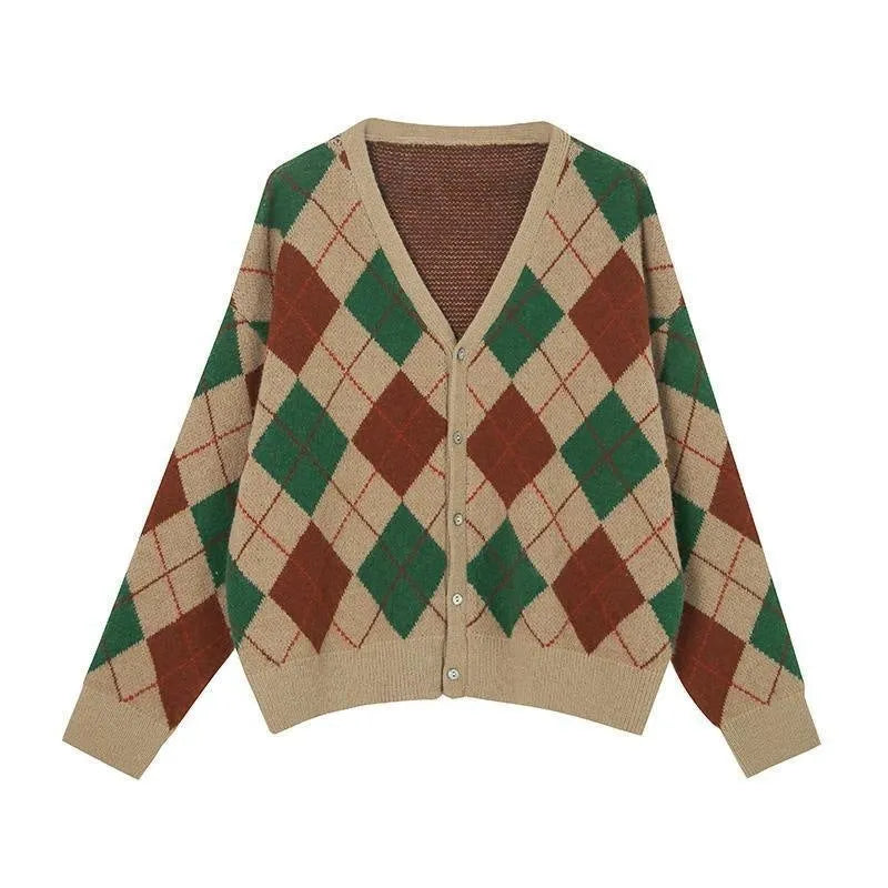 Acrylic knitted cardigan coat in light khaki colour, shown on a hanger.