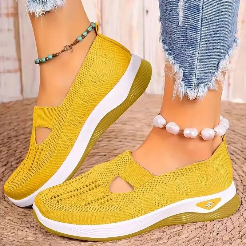Casual mesh walking shoes with T-strap in multiple colours on a soft PVC sole.
