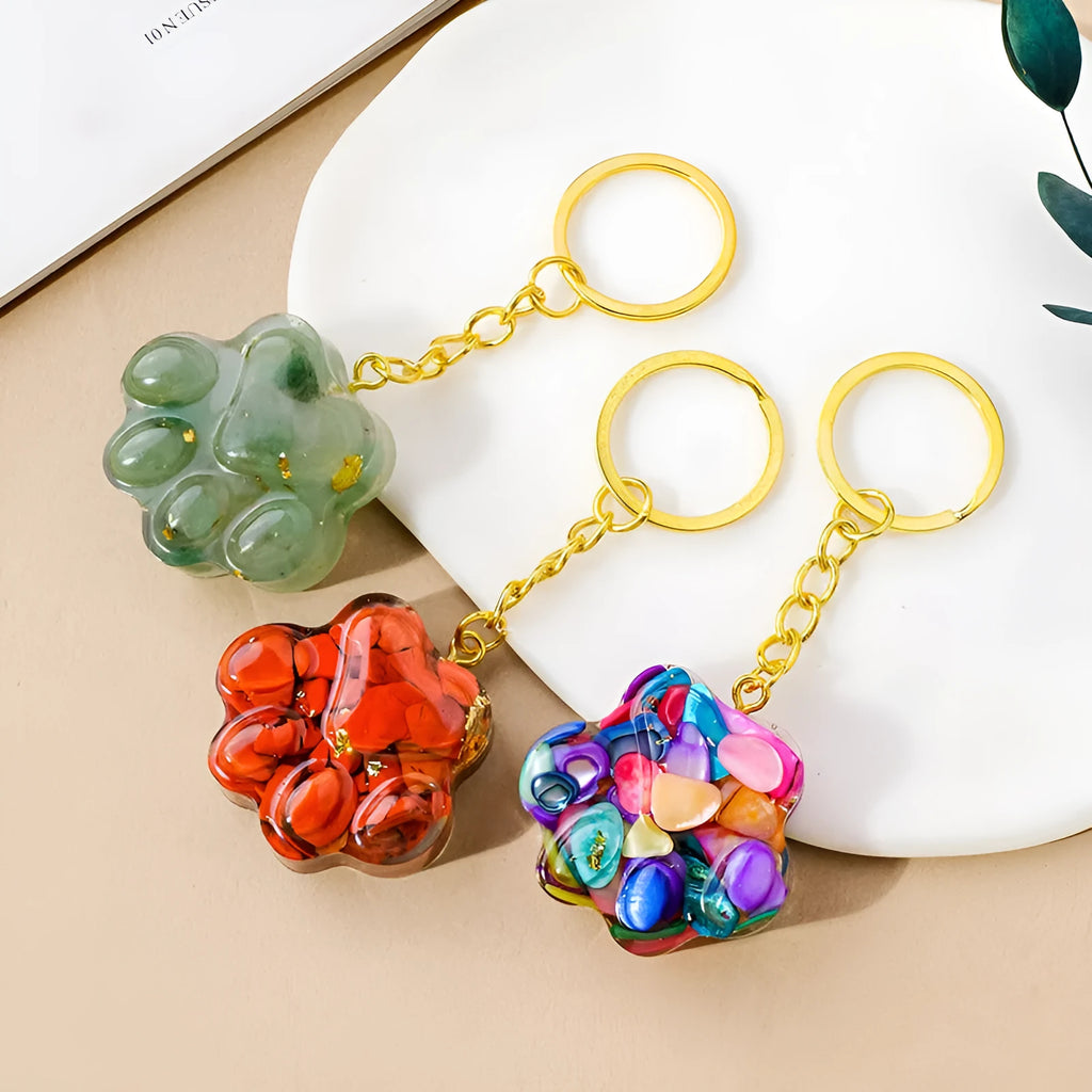 Small natural crystal cat's paw pendant on a metal keyring, available in various stone colours.