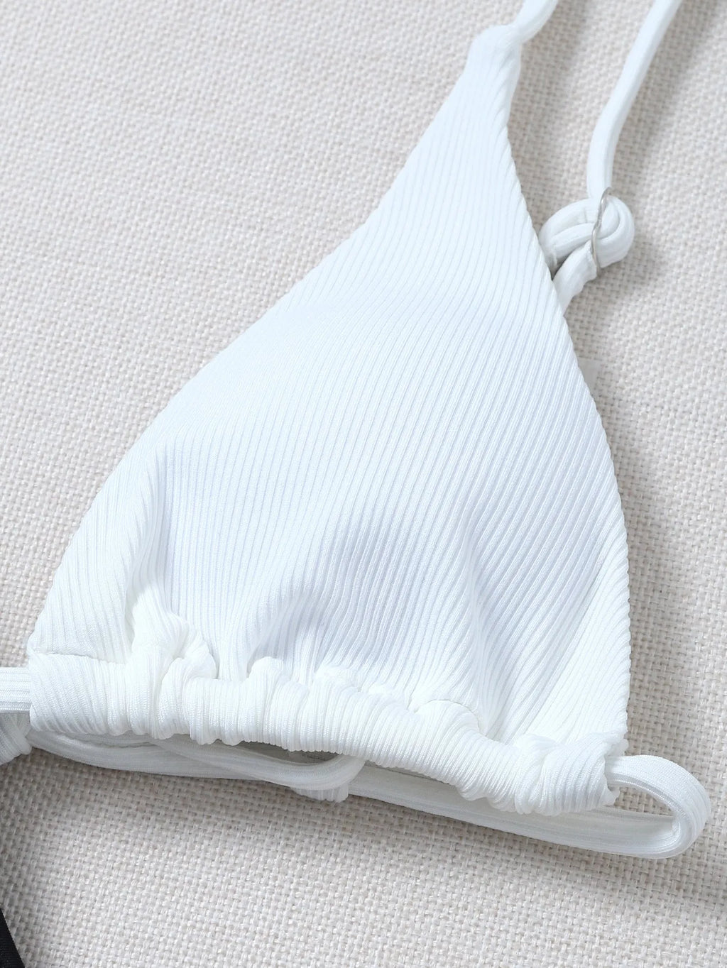 Solid colour bikini with chest pad in black and white, polyester fabric, front view