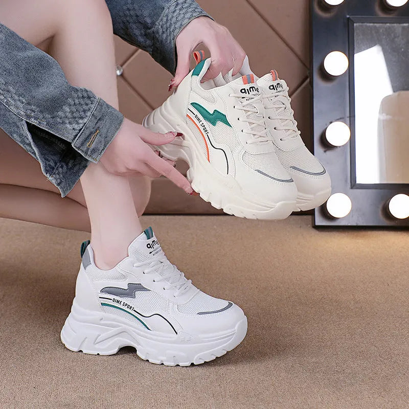 White women's low-top dad shoes with cross shoulder straps and a front lace-up closure.