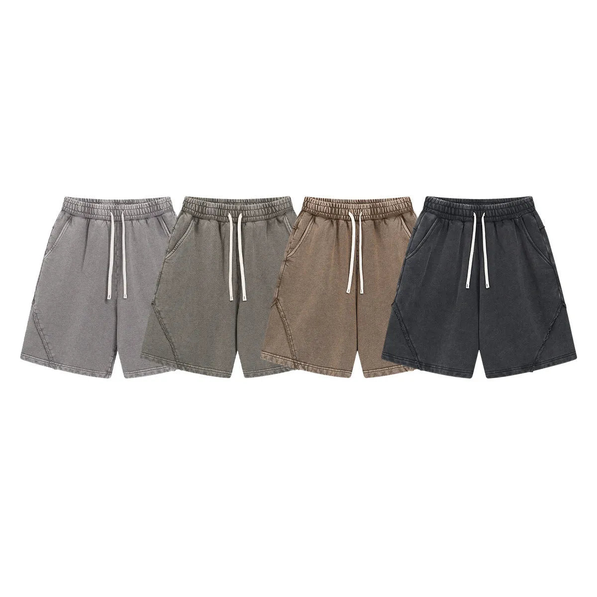 Man wearing batik-washed brown loose-fit cotton terry shorts on a casual street.