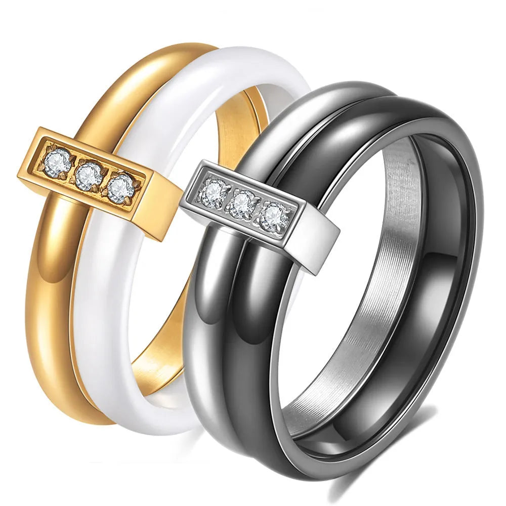 Women's glossy ceramic ring with geometric zirconium inlay in golden white or steel black colour