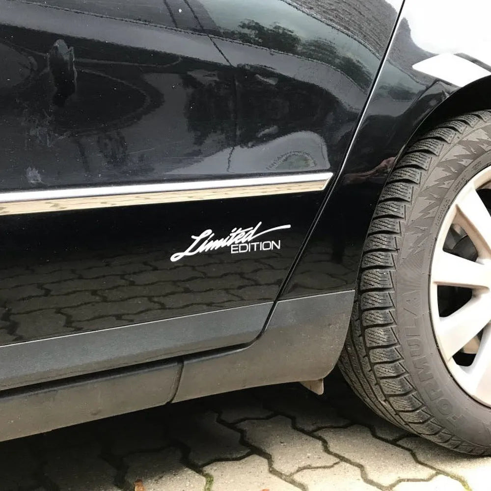 Reflective British style bumper sticker on car, showing black, white and colourful options.