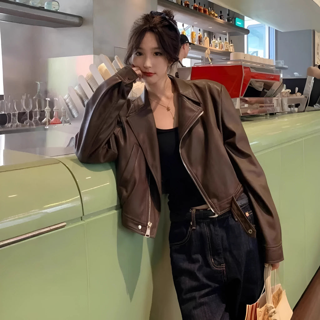 Women's slim fit imitation leather jacket in black with 40cm length and street fashion styling