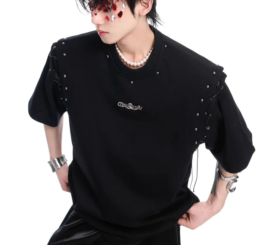 Women's black deconstruction short sleeve t-shirt with a white lace-up detail and front cutout.