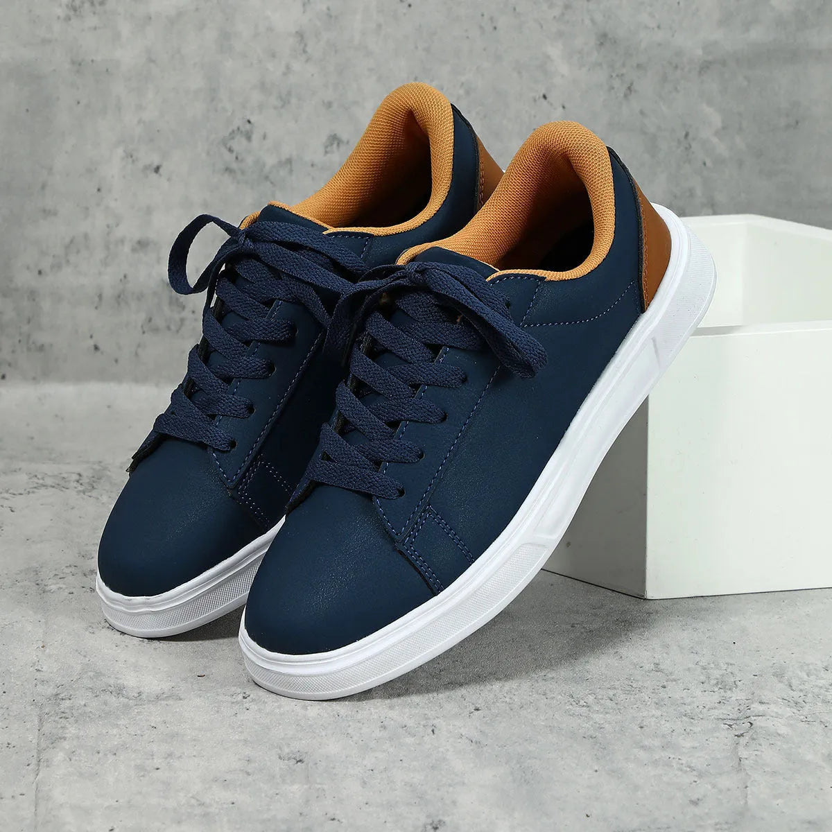 Casual beige brown platform skateboard sneaker with cross strap detail and round toe