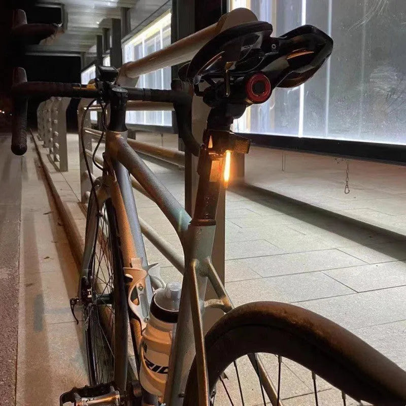 USB-charging waterproof bicycle rear taillight in blue, pink, red, white, or yellow colour options