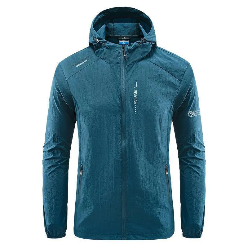 Man wearing a loose-fit light grey hooded nylon jacket for summer sun protection.