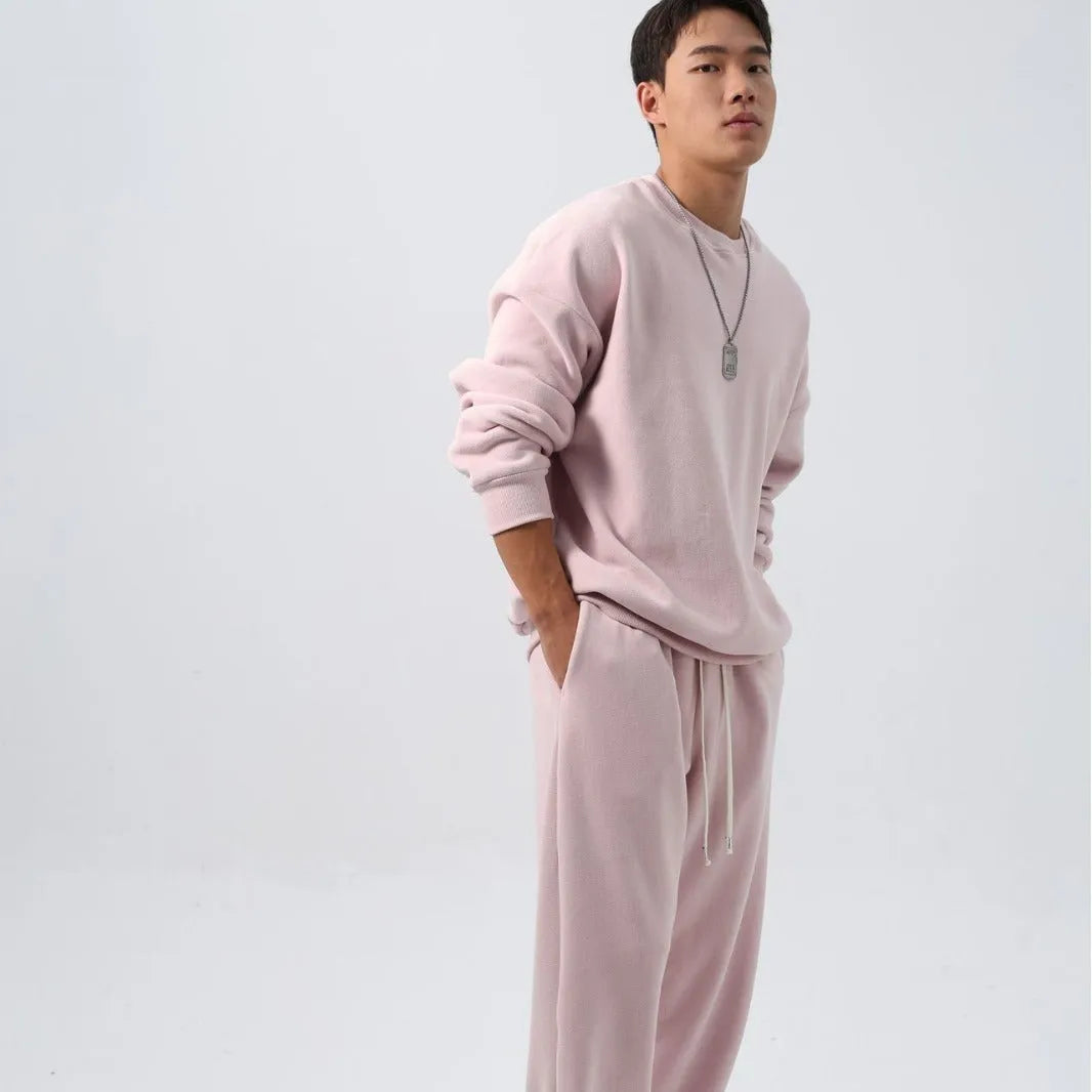 Men's polar fleece sports suit set showing crew neck top with long sleeves and matching padded trousers in winter colours