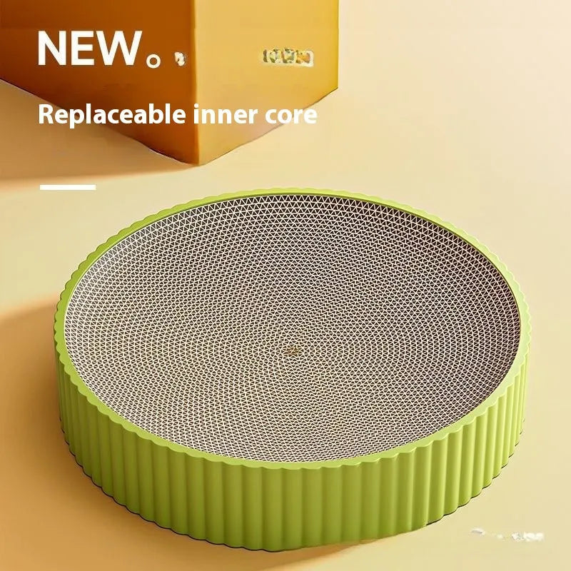 Round green cat scratching board with replaceable corrugated centre measuring 55 cm diameter
