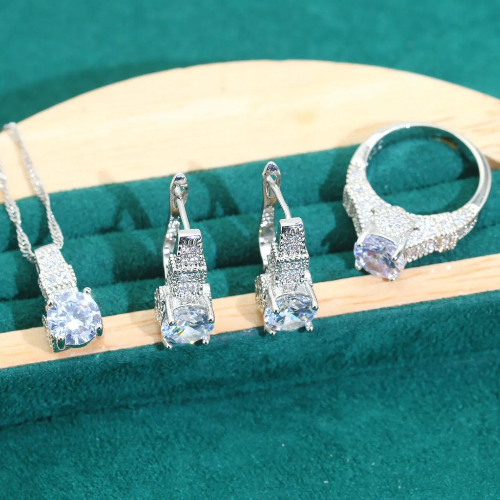 Bridal zircon jewellery four-piece set showing necklace, bracelet, earrings, and ring with water wave chain styling