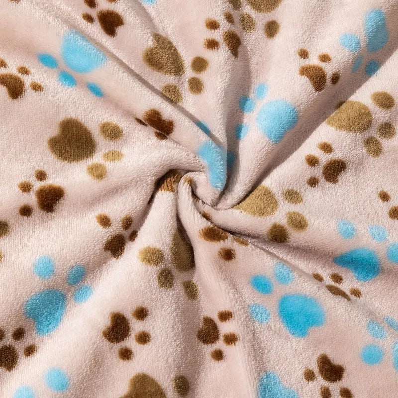 Blue dog cartoon print pet blanket laid flat, showing double-sided flannel texture.