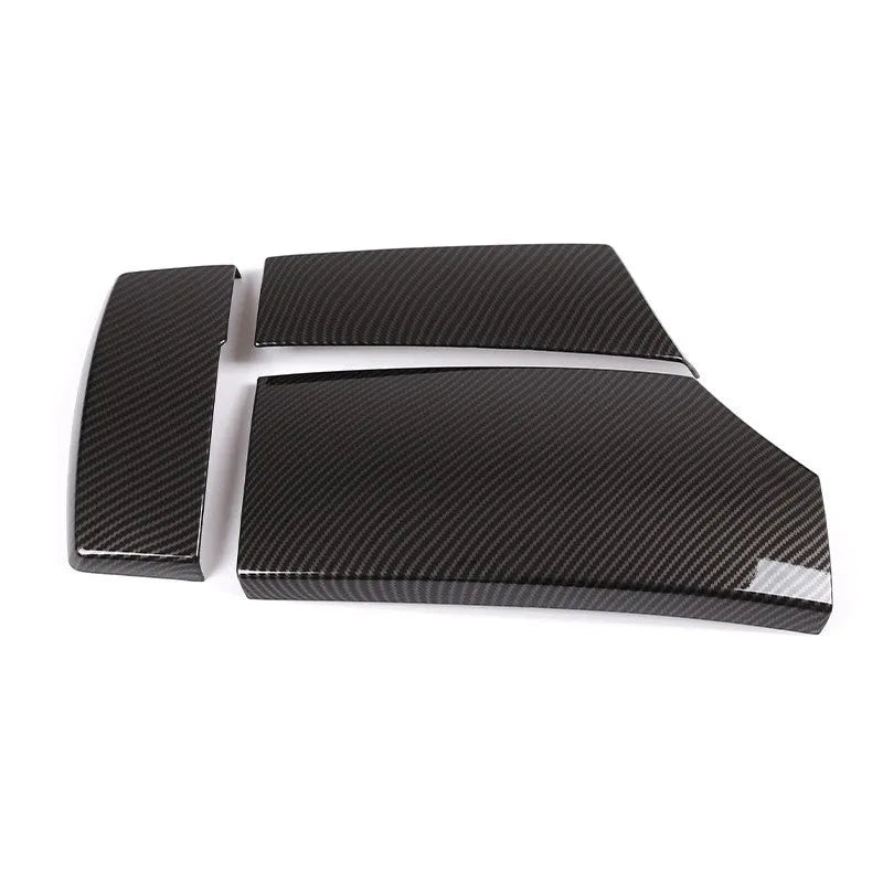 Set of three black ABS armrest box covers with a diagonal carbon fibre pattern and shiny finish.