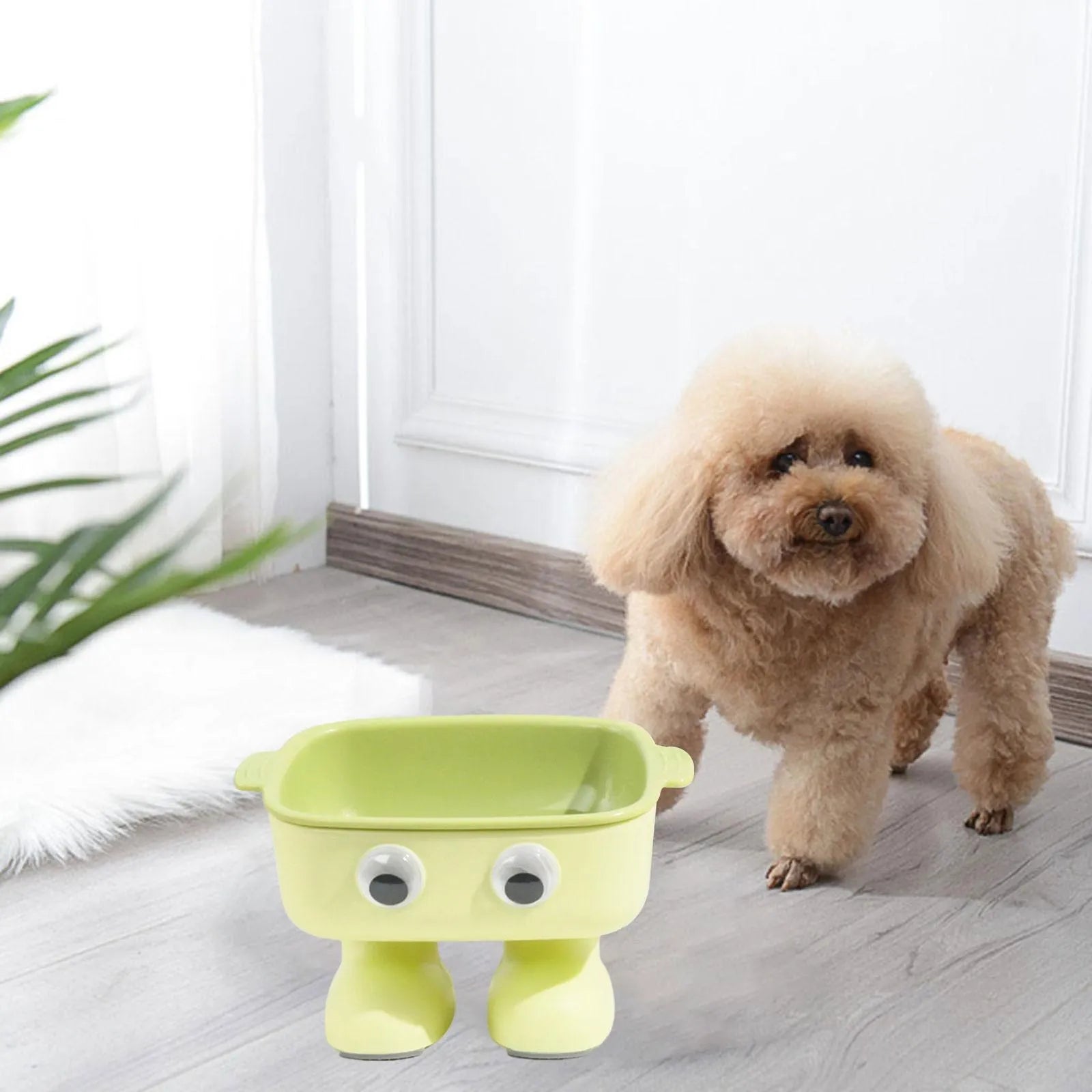 Green elevated cat bowl with robot design, tilted dish, and anti-slip base.